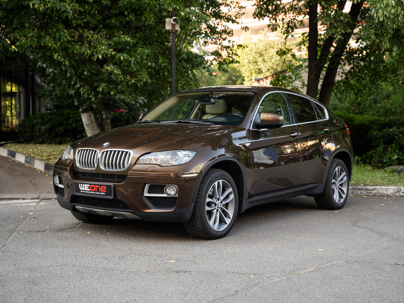 купить BMW X6 xDrive50i рестайлинг 2012   коричневый в Москве
