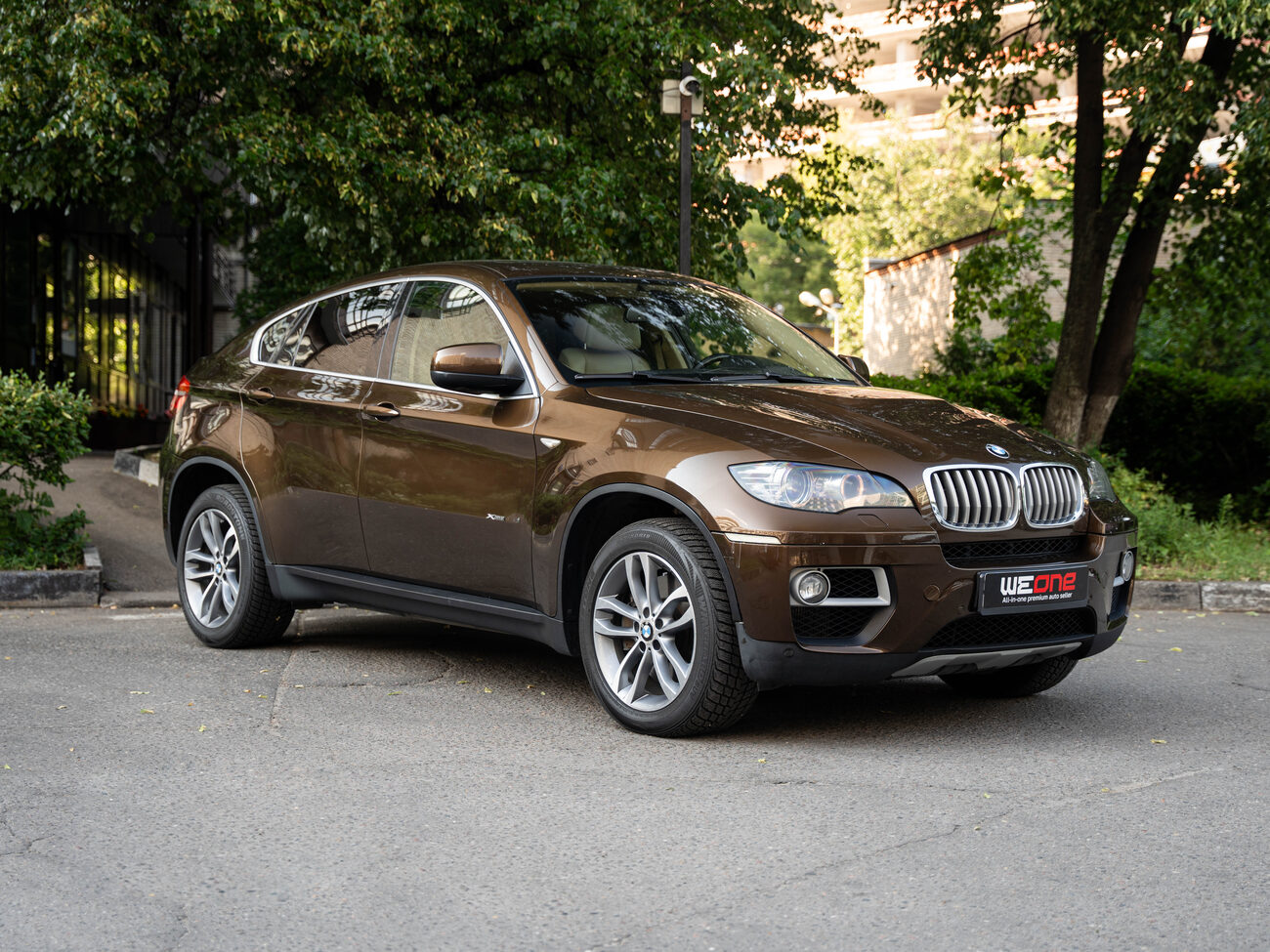 купить BMW X6 xDrive50i рестайлинг 2012   коричневый в Москве